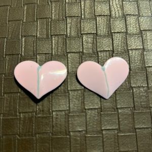 Pink heart shaped metal earrings. Pierced